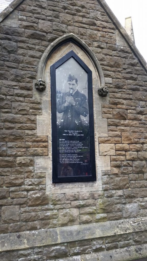 window at chapel showing fighter pilot