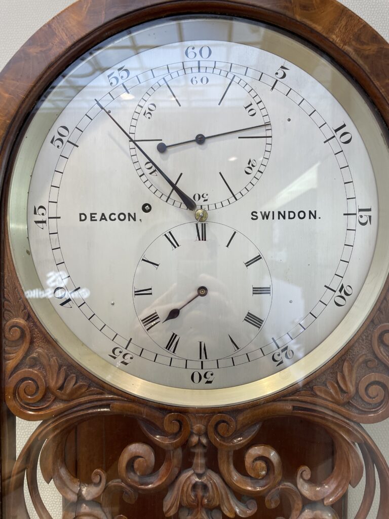Close up of the face of Deacon's regulator clock