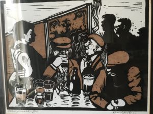 linocut of men drinking in a pub - by Ken White Swindon artist