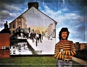 Ken White as a much younger man with the Golden Lion Bridge mural