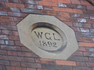 Initial and a date in a roundel on 1-3 Faringdon Road
