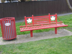 Canadian Spitfire Pilot Memorial Swindon - red bench with Canadian maple leavs on it. 