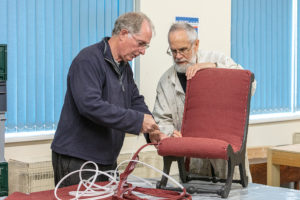 Shedders needed for Swindon Renew - two men working on a chair