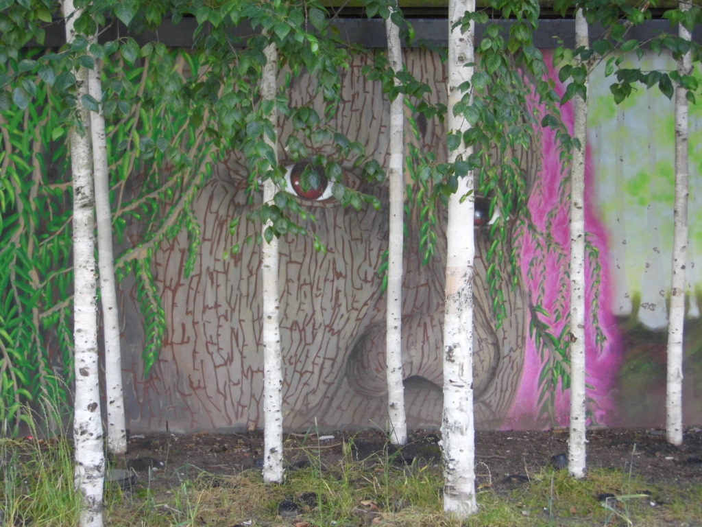 face on wharf green mural