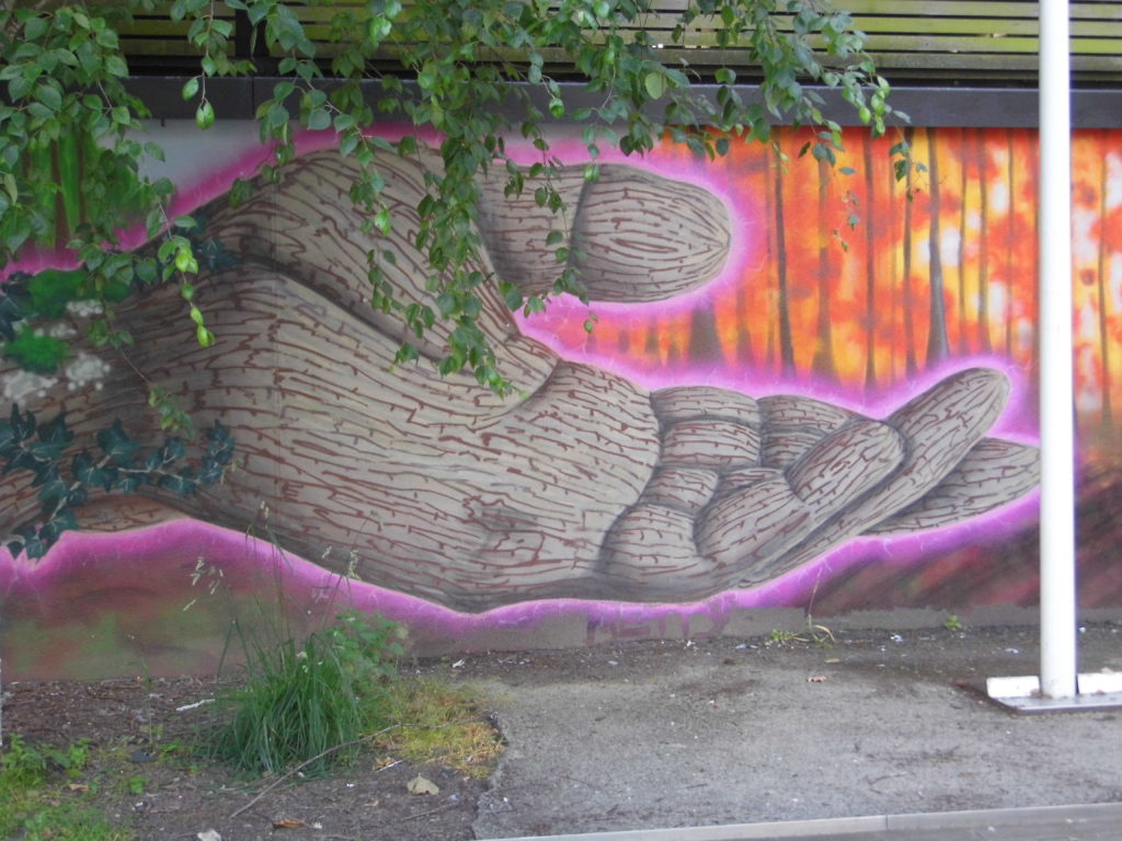 Hand on wharf green mural