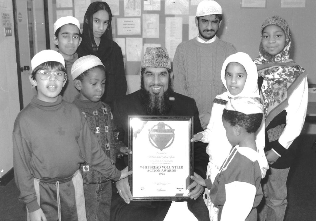 1994-Mohammad-Salas-Khan-with-volunteering-award-for-running-Arabic-language-classes