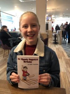 Swindon schoolgirl writes story for charity - Molly Copestake with her book about Mr Pippety Poppety
