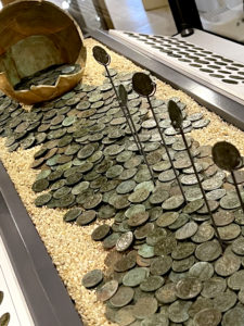 Athelstan Museum Coining It -coins and pot on display
