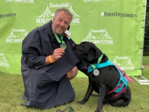 Poppy's charity doggy paddle - Bryan Avery with Poppy