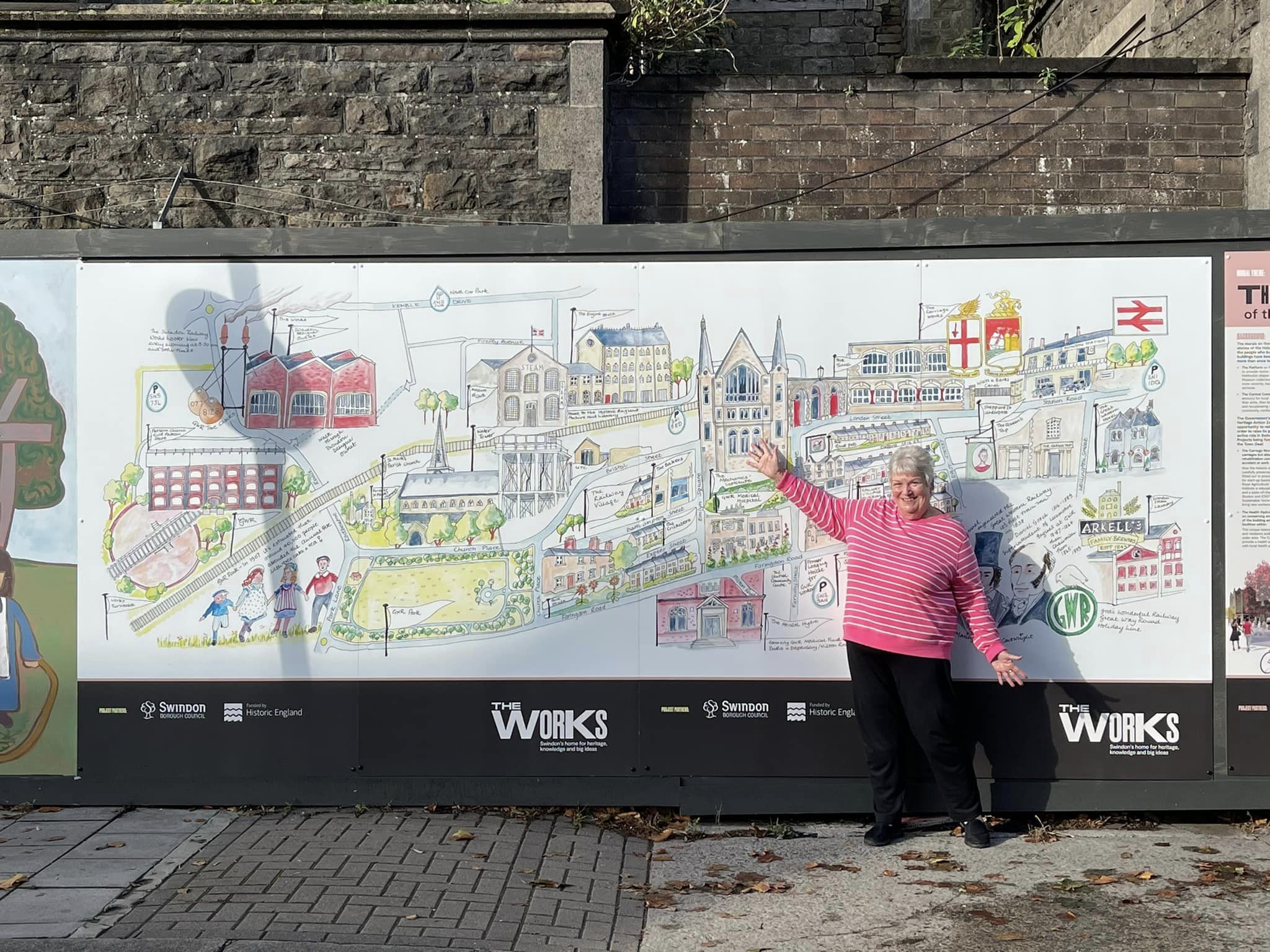 Marilyn Trew in front of her railway village map