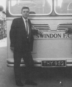 Swindon Footballer Ernie Hunt stood by a marvellous retro Swindon football club coach