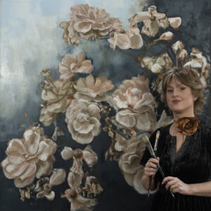 Wiltshire Artist First Solo Exhibition - Caroline Day with one of her floral paintings