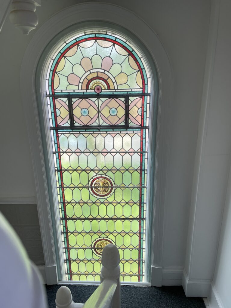 Interior view of the stained glass window on the west wall of Granville House