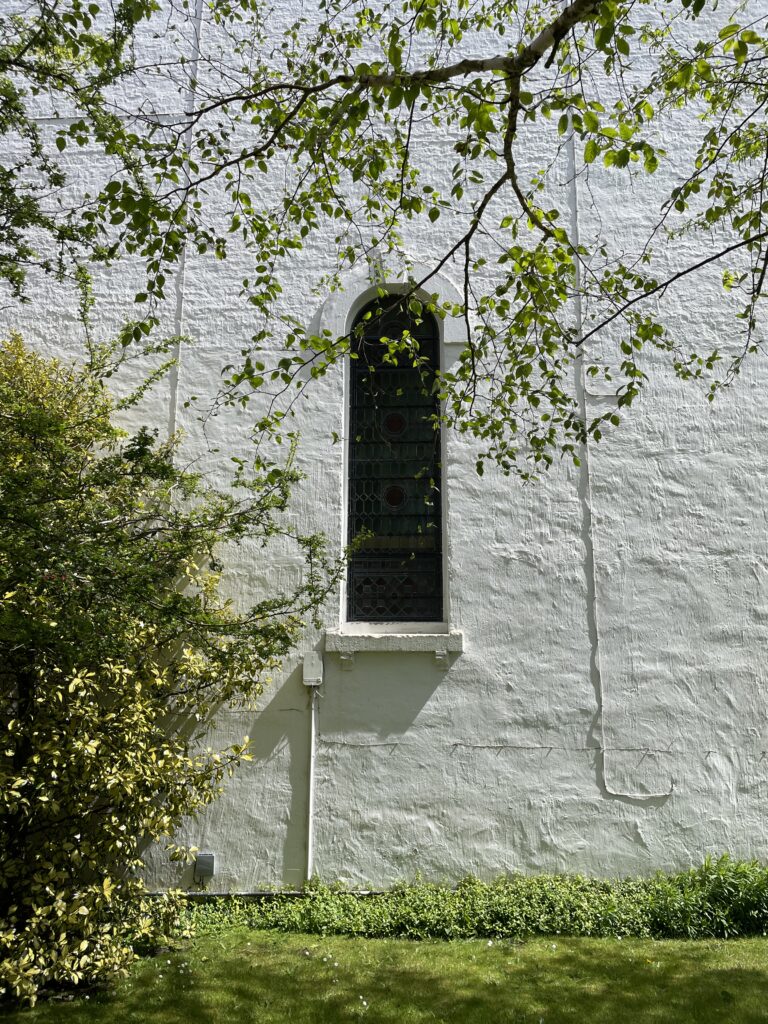 Exterior view of the stained glass window on the west wall of Granville House