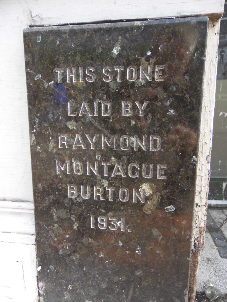Raymond Montague Burton foundation stone on the Burton building in Swindon