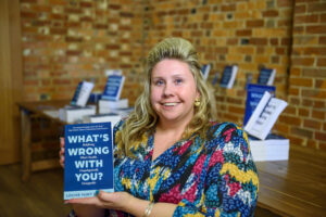 Paralympian to Speak at RWB Library - Louise holding her book