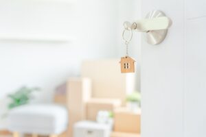 Positive Property Relocation with BlueSky - a key in a lock with boxes in the background.