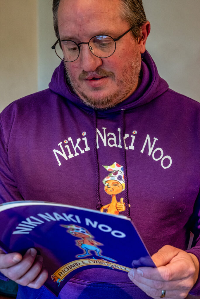 Alex Crump with a copy of Niki Naki Noo