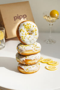 Doughnut Maker Branches Out - Vegan Lemon Glazed Ring Doughnut with Pistachio Nib Sprinkles