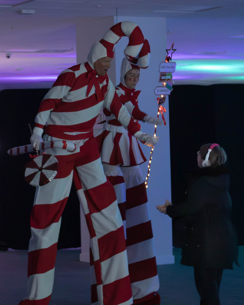 Candy cane stilt walkers