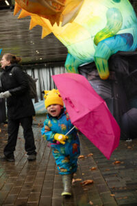 Magical Debut Swindon Winter Fest - small boy smiling with pink umbrella