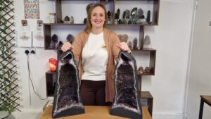 INDEPENDENT BUSINESS STOCKS CRYSTAL ‘CATHEDRALS’ -Louise Muir-Sage, founder of Something Kind of Woo, with two amethyst cathedrals.