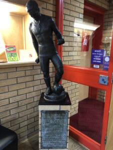 Statue of Harold Fleming the Swindon footballer at Swindon town football club.