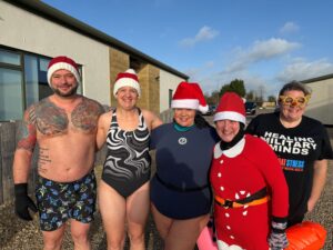 Accountants make a Santa Splash - Kirk Holland and Sally Holland alongside other participants at the Santa Splash.