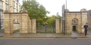 The gate piers and gates behind which, hiding in plain sight, is the Lawn parkland 