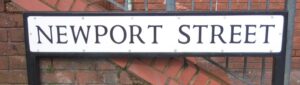 The Newport street sign