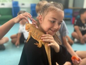 Just For Fun Easter Programme - child with reptile on shoulder