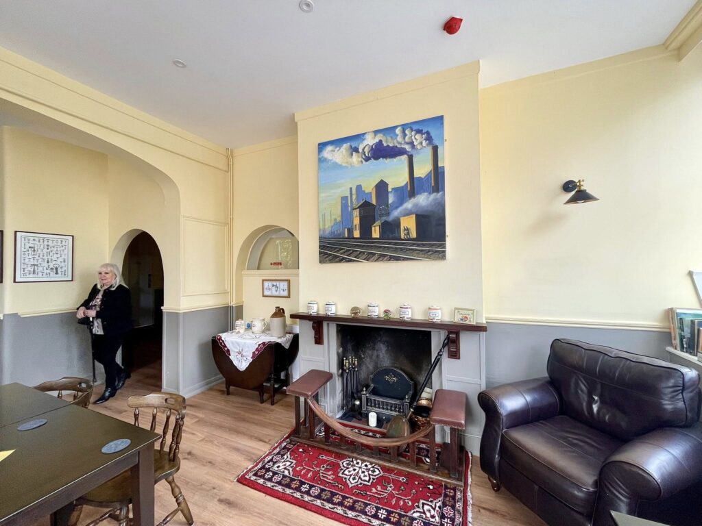 Interior view of the Cricketers showing the fireplace and seating area