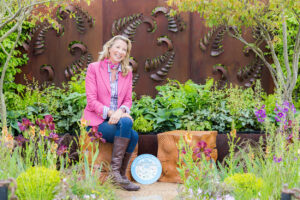 Garden designer sows seeds  - TV Presenter Kate Durr