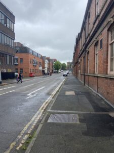 Milton Road 1895 - view from the bottom of the street - the health hydro is on the right - towards the market end of Commercial Road