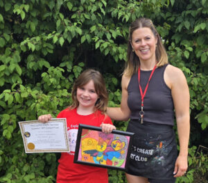 Art Club Celebrates Children's Artwork - Rachel Bray, founder and CEO Let’s Create Art Club, with the winners of their “Swindon Summer Art Competition”.