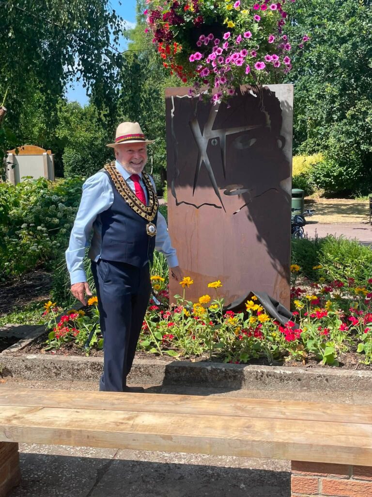 Mayor of Swindon, Neil Hopkins, with the Swindon XTC tribute artwork