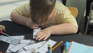 child doing craft work