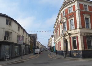 View down Wood Street with The Goddard Arms behind you and looking towards Bath Road