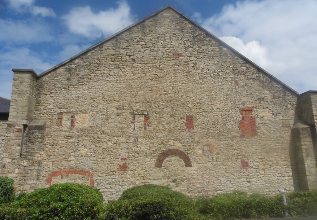 The curious wall of many bricked up apertures