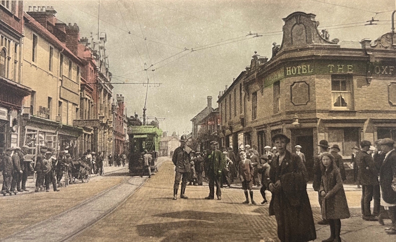 Fleet Street in 1912. Looking eastwards towards the tram centre it shows the Oxford Hotel on the right-hand corner of the image. Before becoming the Oxford it had spent four decades as the Volunteer
